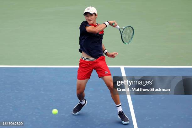 SoonWoo Kwon of South Korea returns a shot against Christopher Eubanks of the United States during their Men's Singles First Round match on Day One...