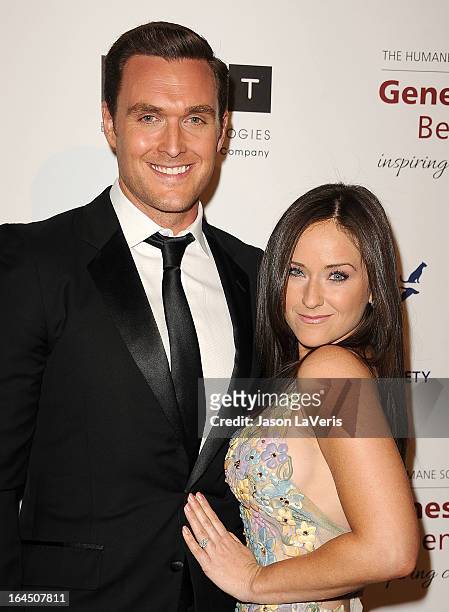 Actor Owain Yeoman and Gigi Yallouz attend The Humane Society's 2013 Genesis Awards benefit gala at the Beverly Hilton Hotel on March 23, 2013 in...