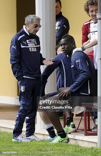 Mario Balotelli of Italy and Doctor Enrico Castellacci during a training session at Coverciano on March 24, 2013 in Florence, Italy.