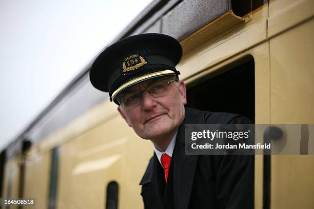 Steward looks on as the Grinsteade Belle arrives at East Grinstead Station for the first time on March 23, 2013 in East Grinstead, England. The...