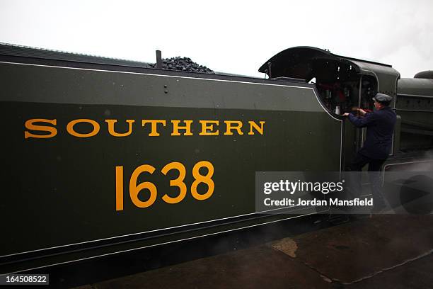 The fireman Darren French boards the Grinsteade Belle on March 23, 2013 in East Grinstead, England. The Bluebell Railway ran its first steam train...