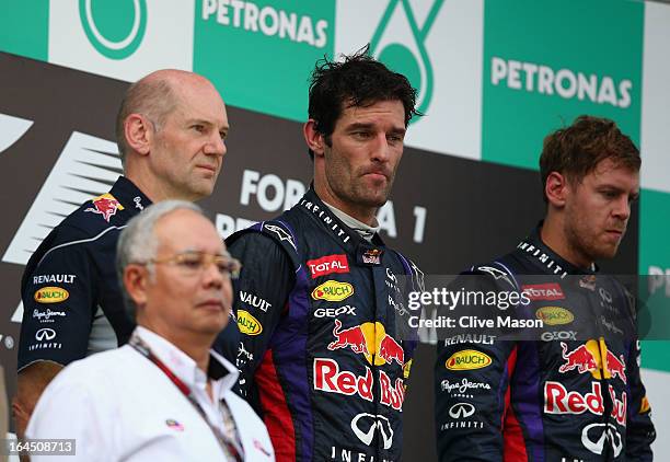 Race winner Sebastian Vettel of Germany and Infiniti Red Bull Racing, second placed Mark Webber of Australia and Infiniti Red Bull Racing and...