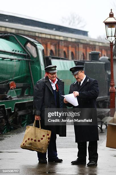 People check the schedule of the locomotives ahead of their maiden trips to East Grinstead on March 23, 2013 in Uckfield, England. The Bluebell...