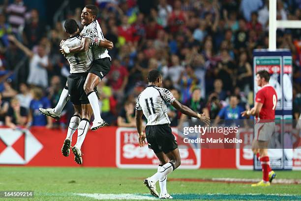 Samisoni Viriviri and Emosi Mulevoro of Fiji celebrate after winning the cup final match between Fiji and Wales during day three of the 2013 Hong...