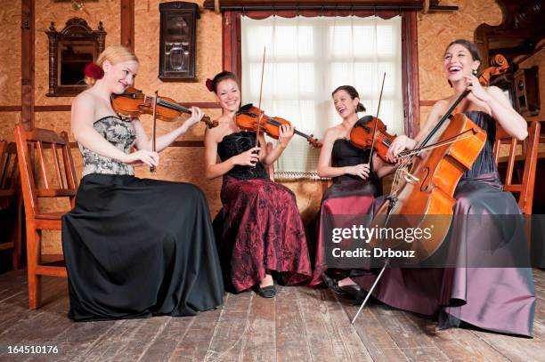 String Quartet Playing Photos and Premium High Res Pictures - Getty Images