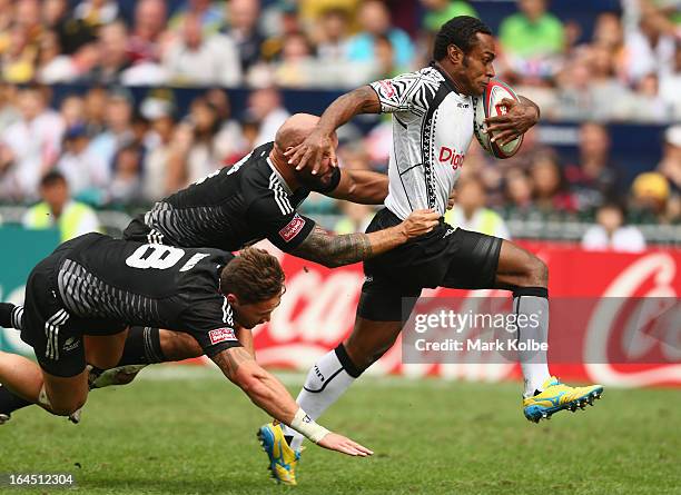 Benito Masilevu of Fiji is tackled during the cup semi final match between New Zealand and Fiji during day three of the 2013 Hong Kong Sevens at Hong...