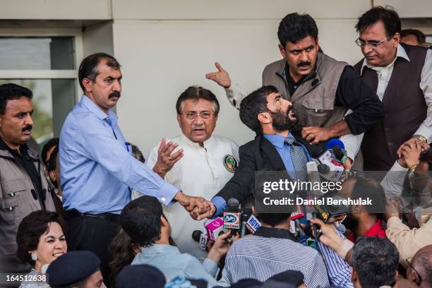 Former Pakistani president, Pervez Musharraf addresses a crowd supporters after landing on Pakistani soil at Jinnah International airport on March...
