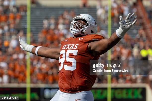 Texas Longhorns defensive lineman Alfred Collins celebrates a blocked pass during the college football game between Texas Longhorns and Rice Owls on...