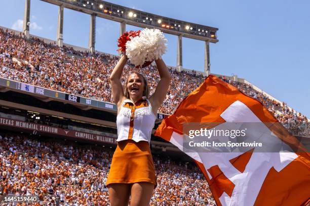 Texas cheerleader cheers before the college football game between Texas Longhorns and Rice Owls on September 2 at Darrell K Royal-Texas Memorial...
