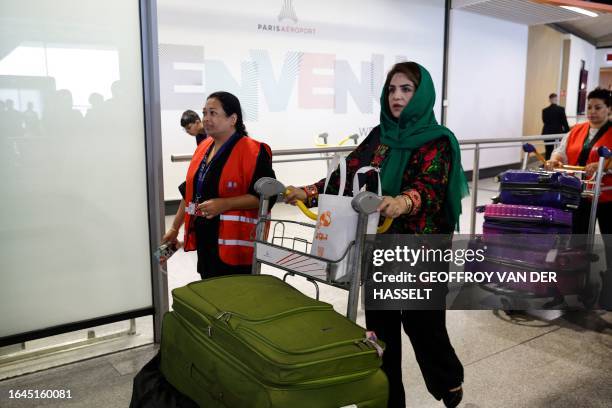 Najla Latif , President of a science faculty is accompagnied by members of the French Office of Immigration and Integration upon her arrival...