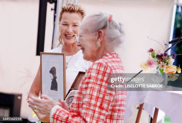 Denmark's Queen Margrethe II presents the Rungstedlund Prize to Danish actress Connie Nielsen at Rungstedlund, also known as the Karen Blixen Museum,...