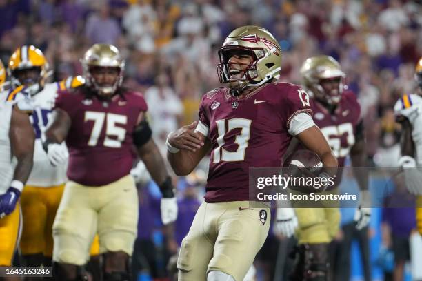 Florida State Seminoles quarterback Jordan Travis (130 shouts in celebration after his rushing touchdown in the second half during the Camping World...