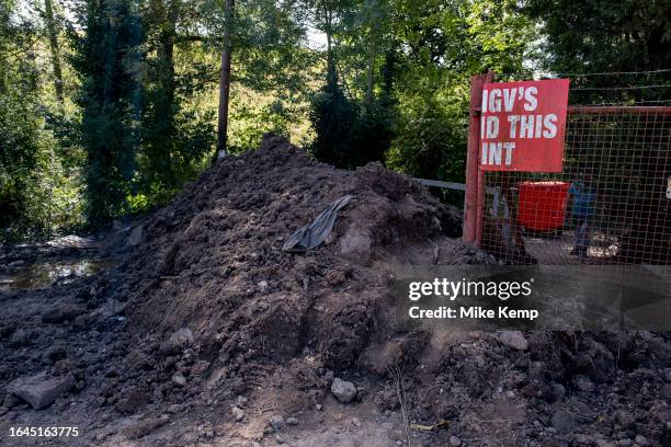 Piles of earth blocking the lane to The Crooked House pub in Himley where a fire broke out on the weekend amidst unexplained circumstances, and which...