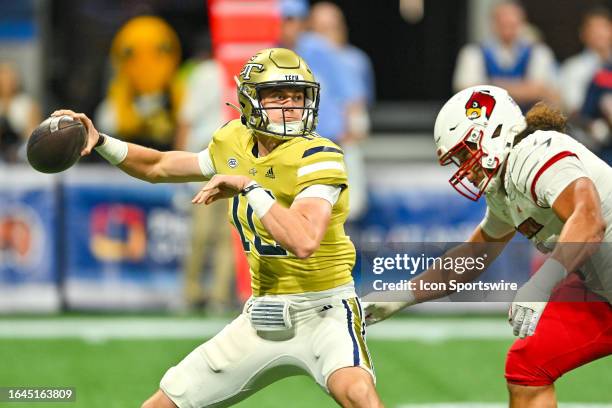 Georgia Tech quarterback Haynes King drops back to pass during the Aflac Kickoff Game between the Louisville Cardinals and the Georgia Tech Yellow...