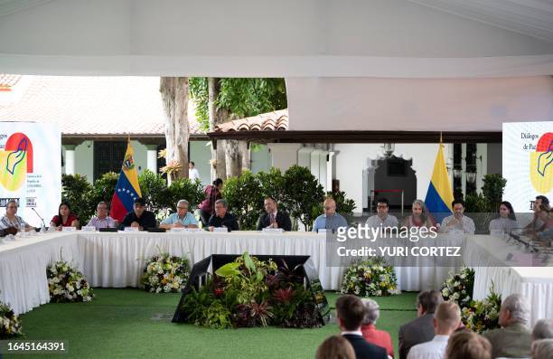 Delegates of Colombia's last active guerrilla group, the National Liberation Army , and Colombian Government delegates , accopanied by Venezuela's...