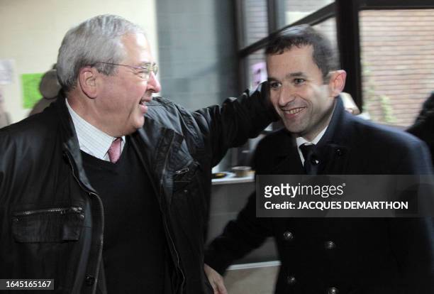 French Socialist party spokesman Benoit Hamon and Ile-de-France regional council President Jean-Paul Huchon are pictured as they came to support...