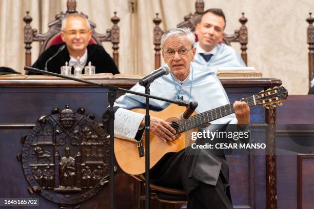Brazilian musician Caetano Veloso sings and plays guitar after being granted an "honoris causa" honoray doctorate at the University of Salamanca , in...