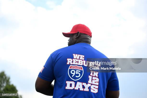 Man wears a t-shirt that reads “WE REBUILT INTERSTATE 95 IN 12 DAYS” before U.S. President Joe Biden arrives to address union workers at Sheet Metal...