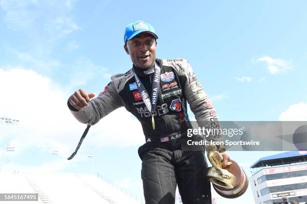 Antron Brown DSR-DSM AB Motorsports Toyota NHRA Top Fuel Dragster driver sees his niece in the crowd after winning the NHRA Camping World Drag Racing...