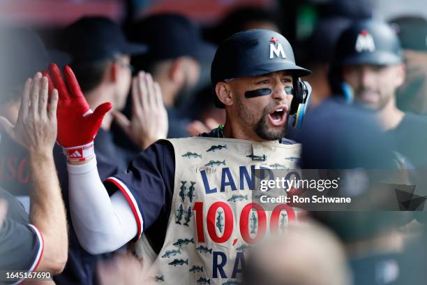 Royce Lewis of the Minnesota Twins celebrates in the dugout after hitting a grand slam off Lucas Giolito of the Cleveland Guardians during the second...