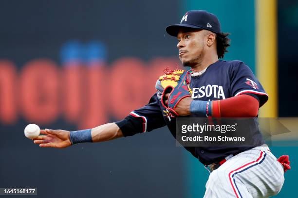 Jorge Polanco of the Minnesota Twins throws out Andres Gimenez of the Cleveland Guardians at first base during the fourth inning at Progressive Field...