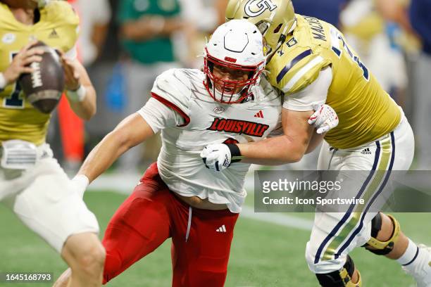 Louisville Cardinals defensive lineman Ashton Gillotte rushes on defense during the Aflac Kickoff college football game against the Georgia Tech...