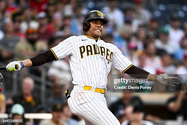 Juan Soto of the San Diego Padres reacts as he takes a strike during the eighth inning of a baseball game against the Philadelphia Phillies on...