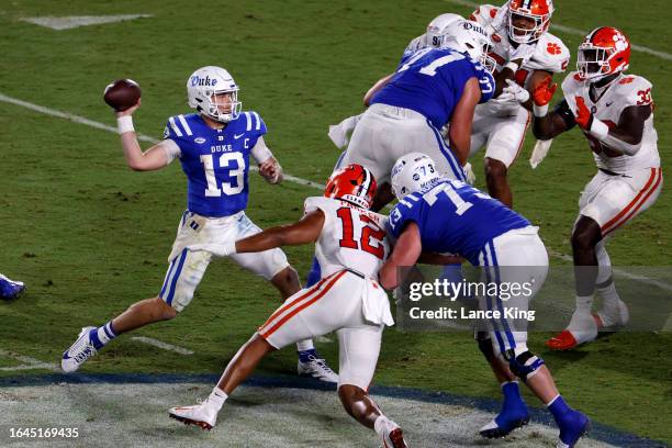 Riley Leonard of the Duke Blue Devils drops back to pass against the Clemson Tigers during the first half of the game at Wallace Wade Stadium on...