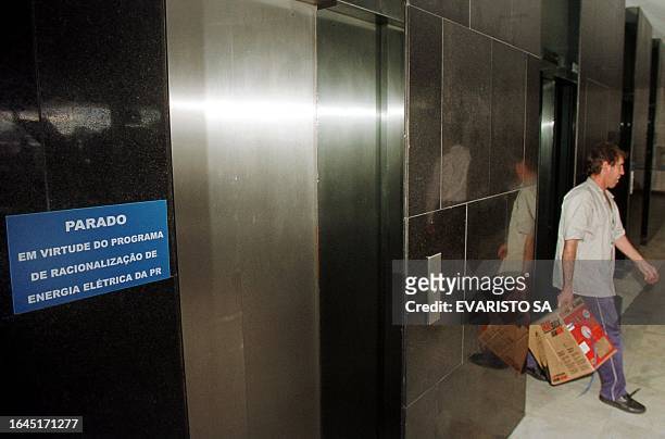 Sign outside one of the elevators in the Government Palace reads, "Not working due to the electricity rationing plan of the President," 30 May 2001,...