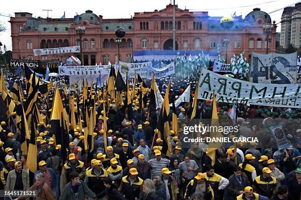 Hundreds of workers gather at the Plaza de Mayo, in front of the President's house , 31 May 2001, to protest against his government's social and...