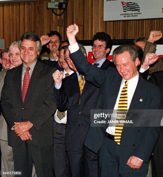 British Gas of Brazil president Barry Adams, celebrates his company's winning bid for the state-owned Gas Company of Sao Paulo, Comgas, 14 April 1999...
