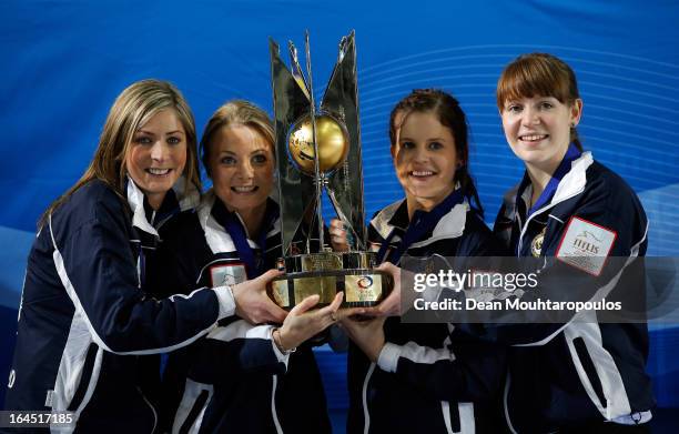 Eve Muirhead, Anna Sloan, Vicki Adams and Claire Hamilton pose with the trophy after winning the Gold medal match between Sweden and Scotland on Day...