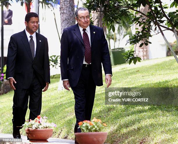 Presidents Francisco Flores of El Salvador and Abel Pacheco of Costa Rica are seen walking the grounds of the President's House in San Salvador, El...