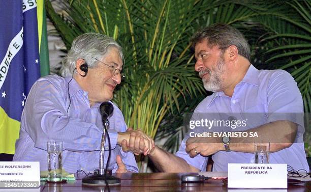 World Bank President James Wolfensohn , and Brazilian President Luiz Inacio Lula da Silva, shake hands after reaching an agreement over a 505 million...