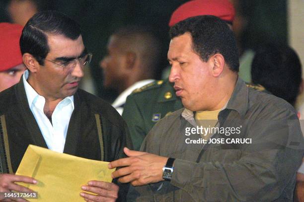 Venezuelan President Hugo Chavez meets with Lucas Rincón Romero for an informal political ceremony 08 February 2003 in Caracas. Chavez earlier...
