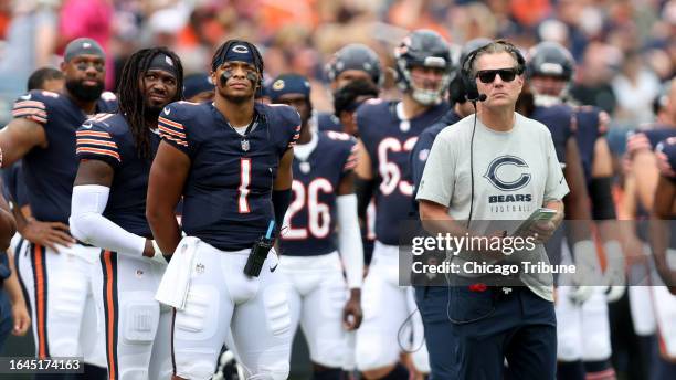 Bears quarterback Justin Fields and coach Matt Eberflus stand on the sideline during a preseason game against the Bills on Aug. 26 at Soldier Field.