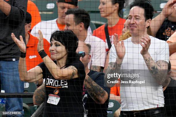 Singer Joan Jett cheers on the Baltimore Orioles during the first inning of a game against the Chicago White Sox at Oriole Park at Camden Yards on...