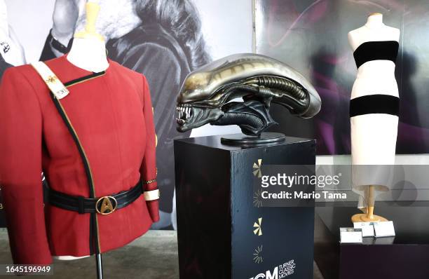 Starfleet jacket worn by William Shatner in 'Star Trek II: The Wrath of Khan', a Xenomorph creature head used for the film 'Alien', and a gown worn...