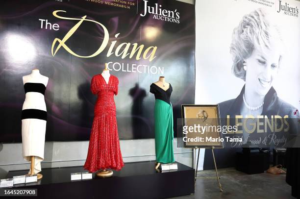 Gowns owned by Princess Diana are displayed during a media preview of ‘Legends: Hollywood & Royalty’ at Julien's Auctions on August 28, 2023 in...