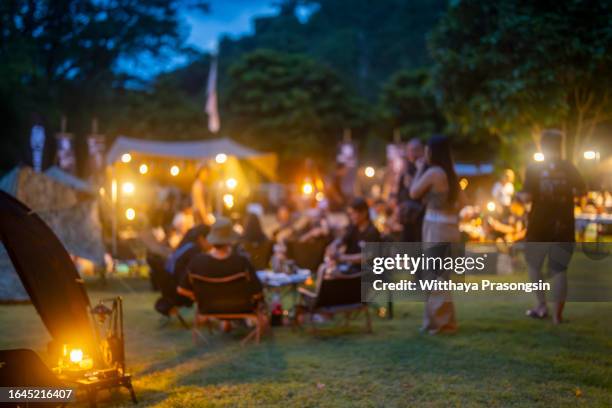 festival party camp with hipster people blurred background - camp party fotografías e imágenes de stock