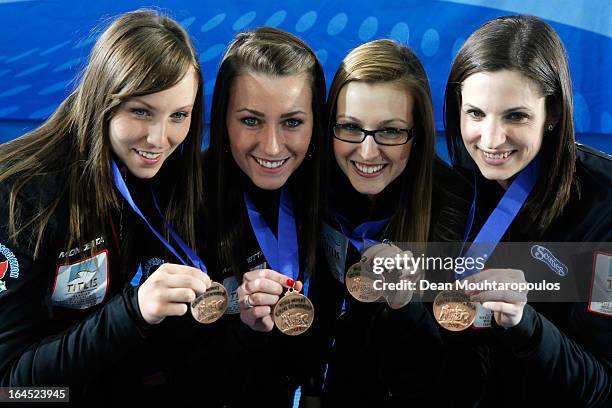 Rachel Homan, Emma Miskew, Alison Kreviazuk and Lisa Weagle of Canada pose with the their medals after winning the bronze medal on Day 9 of the...