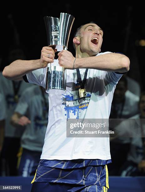 Sven Schultze, capatin of Berlin celebrates with the trophy after winning the Beko BBLTop Four final game between Ratiopharm Ulm and Alba Berlin at...