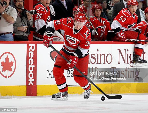 Jussi Jokinen of the Carolina Hurricanes skates with the puck during their NHL game against the Florida Panthers at PNC Arena on March 19, 2013 in...