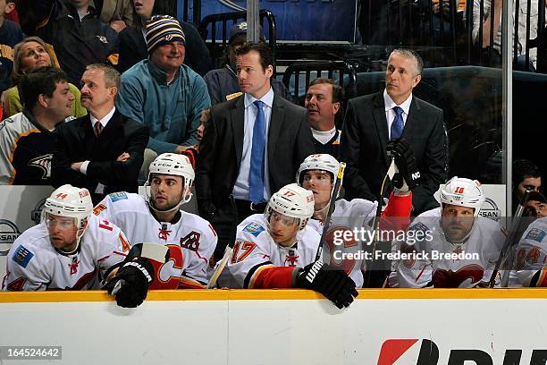 Head coach Bob Hartley and assistant coach Martin Gelinas of the Calgary Flames watch their team skate against the Nashville Predators Bridgestone...
