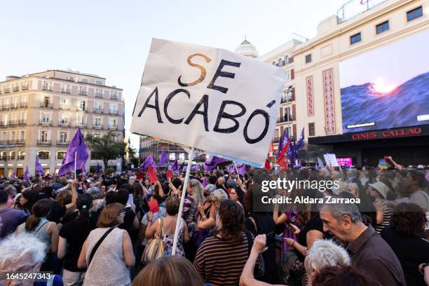 Protesters hold a sign that reads "It's over" during a demonstration called by feminist associations in support to Spain's player Jenni Hermoso, at...