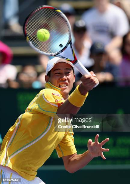 Kei Nishikori of Japan plays a forehand against Xavier Malisse of Belgium during their third round match at the Sony Open at Crandon Park Tennis...