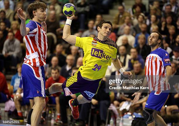 Bartlomiej Jaszka of Berlin throws the ball during the HBL Champions League round of sixteen game between Fuechse Berlin and Atletico Madrid at Max...