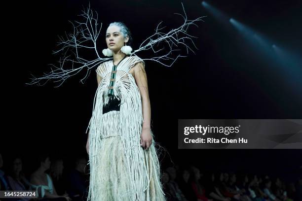 Model walks the runway during the Kiri Nathan show at New Zealand Fashion Week 23: Kahuria at Viaduct Events Centre‎ on August 29, 2023 in Auckland,...