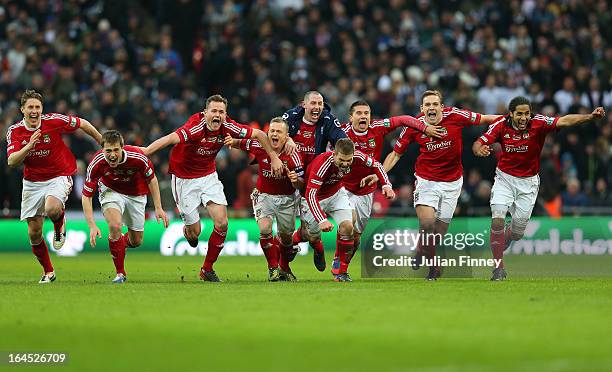 Wrexham players celebrate after a penalty shoot during the FA Trophy Final match between Wrexham and Grimsby Town at Wembley Stadium on March 24,...