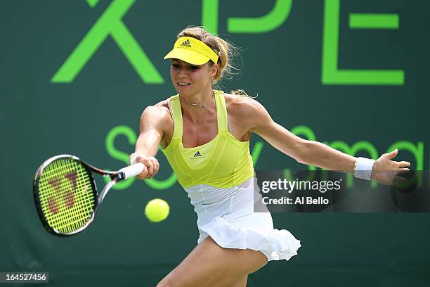 Maria Kirilenko of Russia returns a shot to Klara Zakopalova of the Czech Republic during Day 7 of the Sony Open at the Crandon Park Tennis Center on...